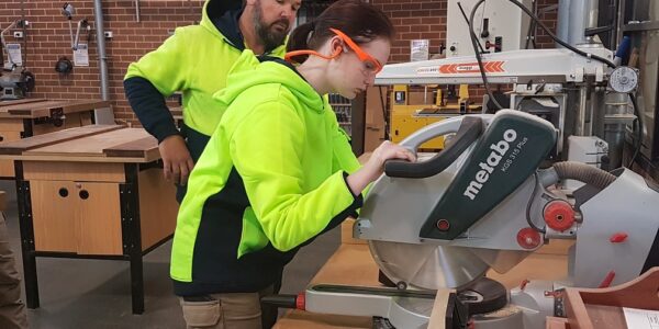 Ana using the Drop Saw